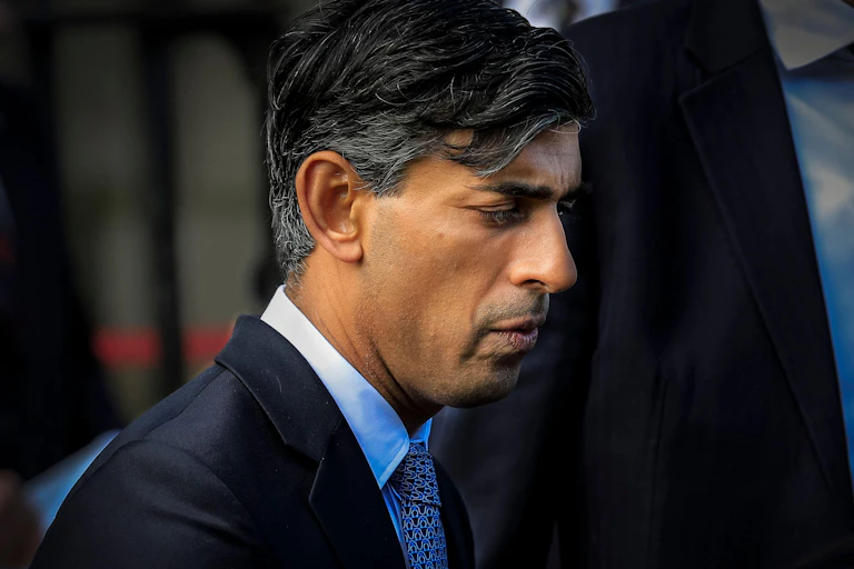 Rishi Sunak looking very serious and worried