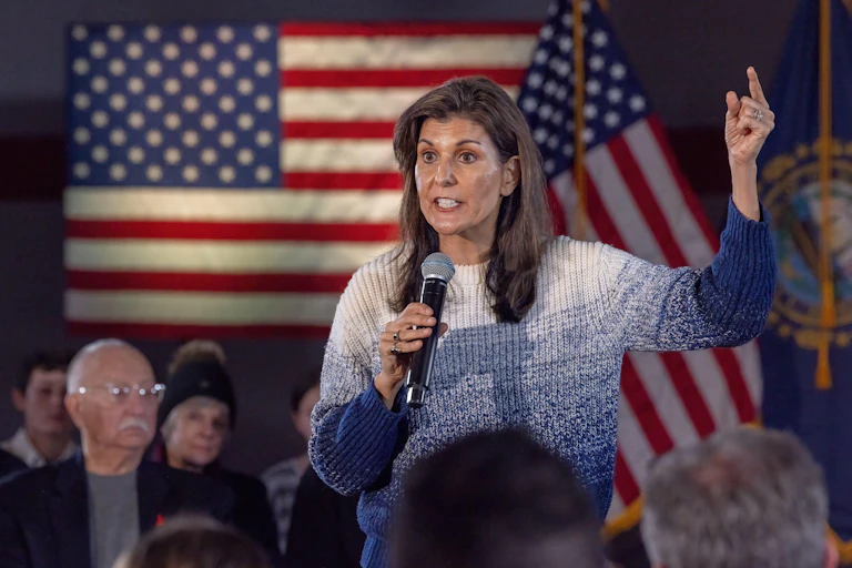 Nikki Haley in front of US flag/