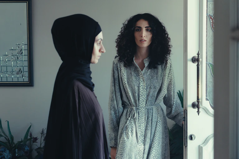 Two women, one in a hijab.