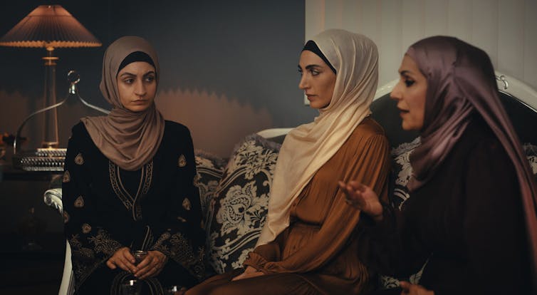 Three hijabi women.