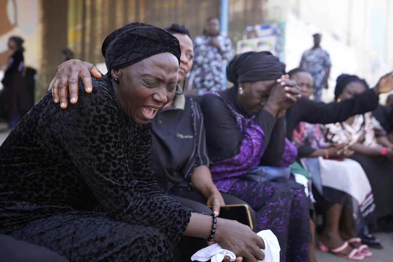 Women in Nigeria cry over attacks on civilians.