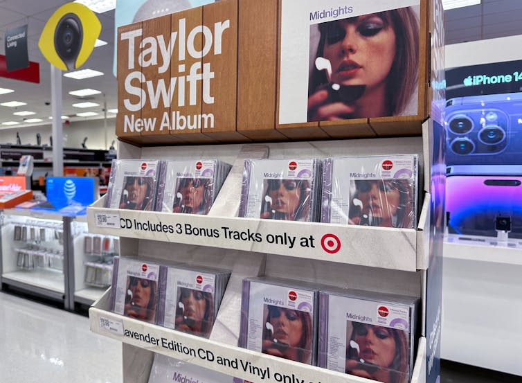Taylor Swift albums on shelves in music store