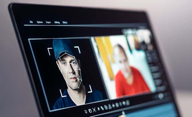 Computer software mapping a person's face to generate a deepfake video
