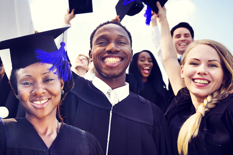 Students in graduation caps and gowns.