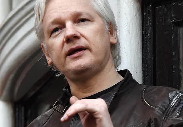 Julian Assange speaks to the media