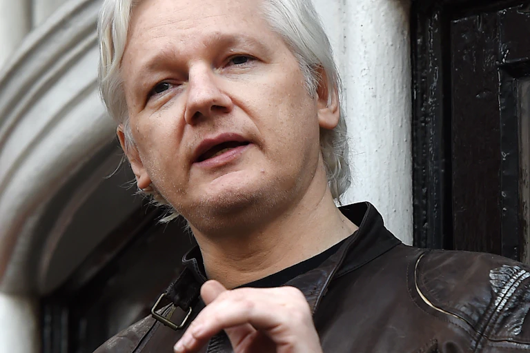 Julian Assange speaks to the media