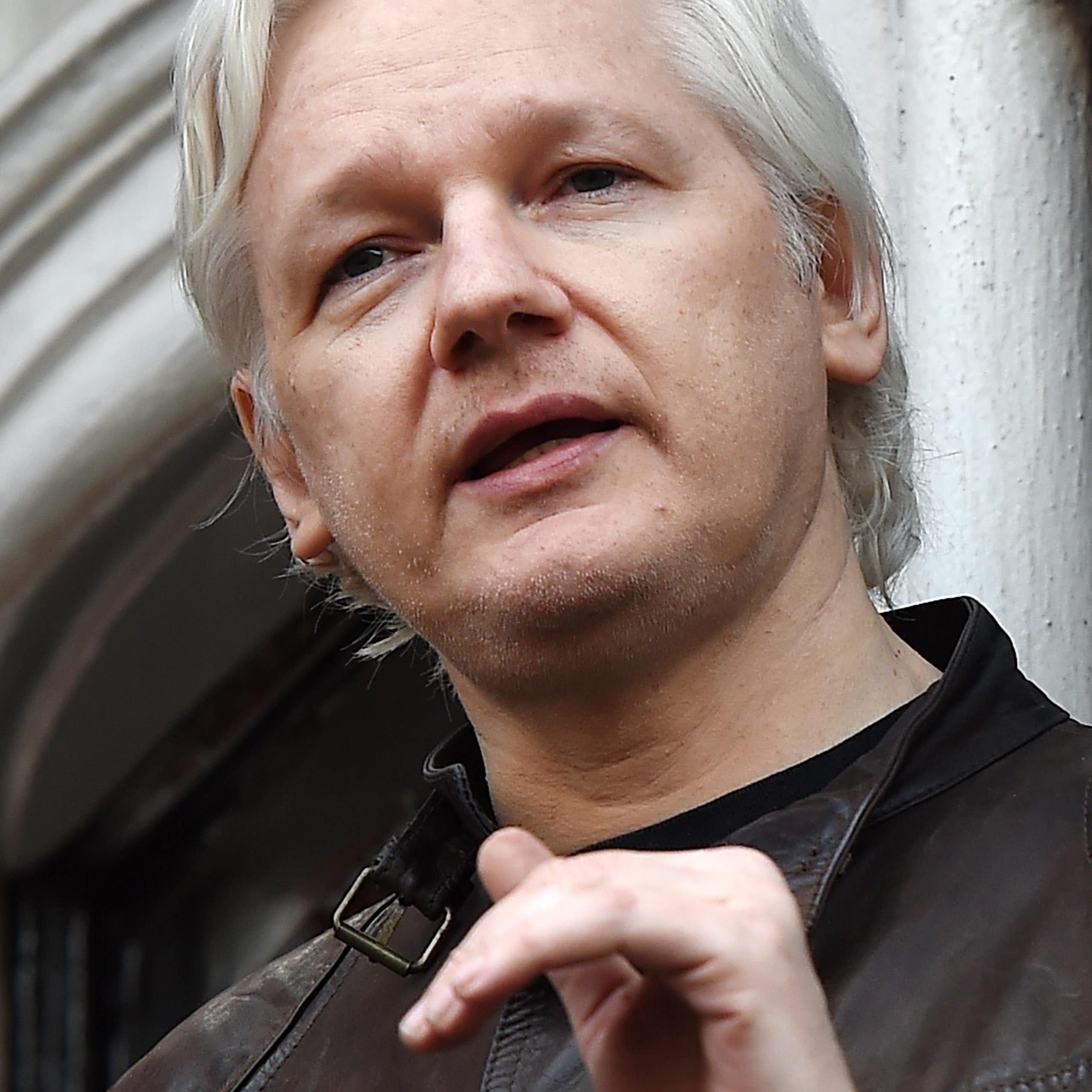 Julian Assange speaks to the media