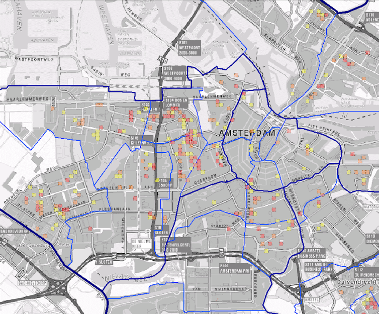 A city map with numerous small red, orange and yellow squares