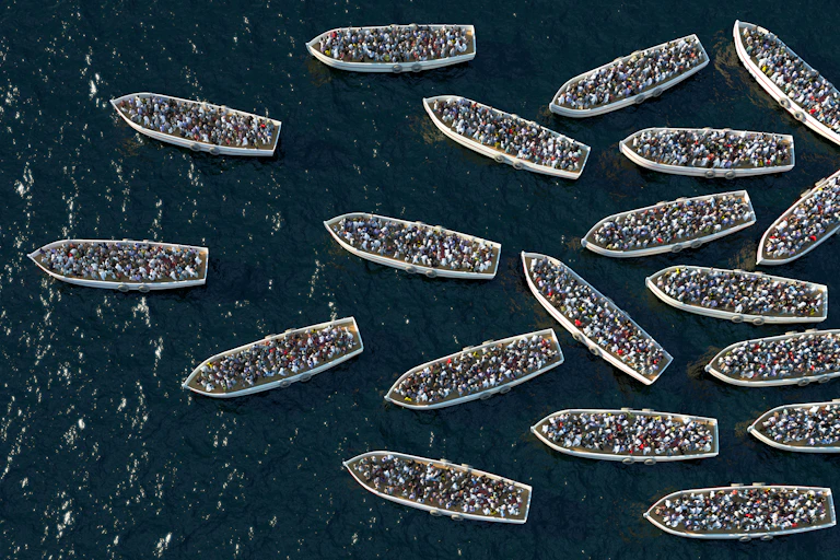 Small boats filled with people on the ocean