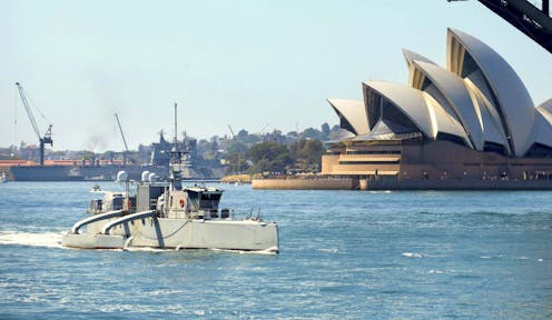 Australia wants navy boats with lots of weapons, but no crew. Will they run afoul of international law?