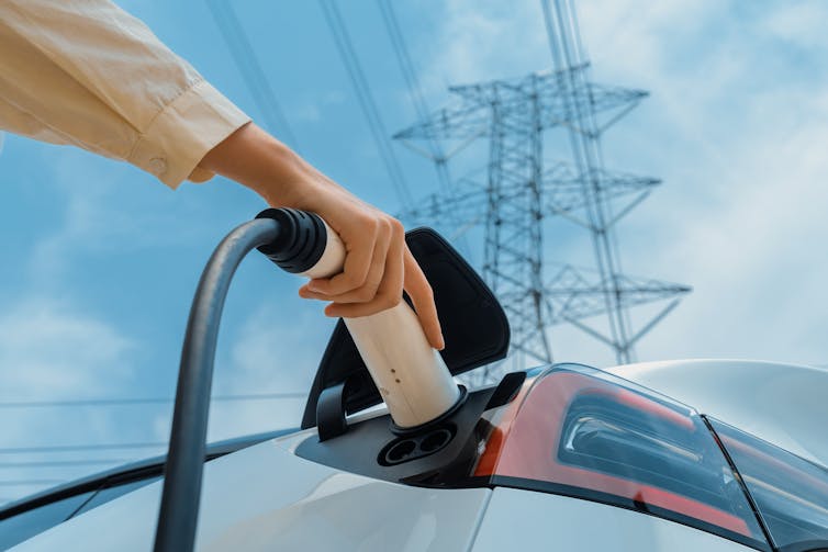 recharging electric car with grid in background