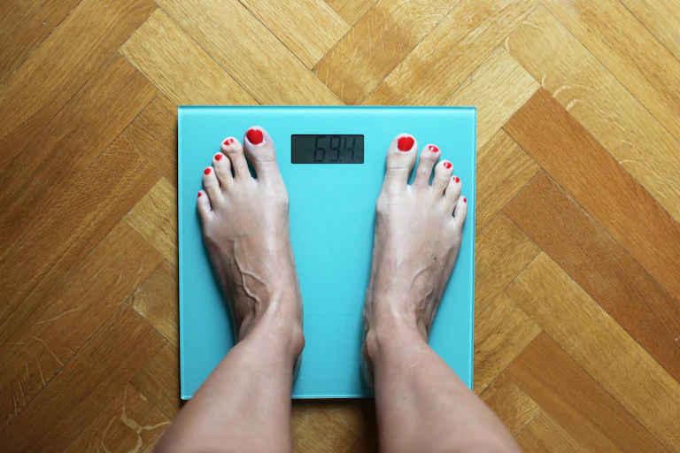 Person standing on a bathroom scale