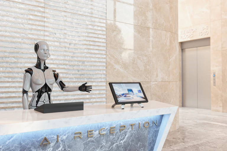 A robot stands at the reception desk of a hotel.