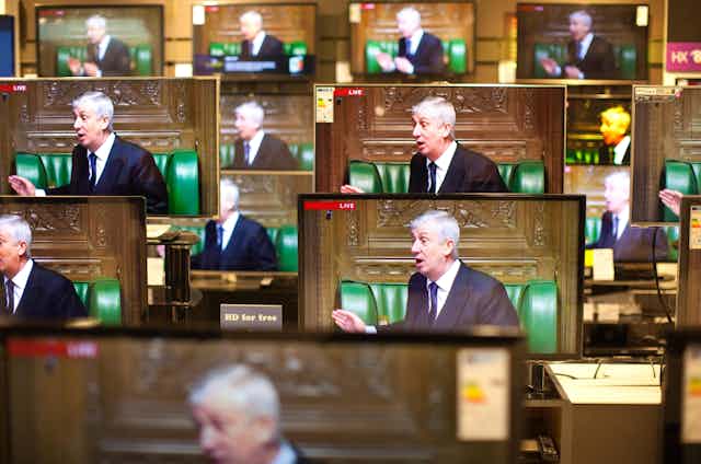 A series of TV screens each displaying an image of Lindsay Hoyle in the Commons chamber
