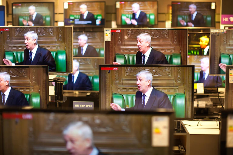 A series of TV screens each displaying an image of Lindsay Hoyle in the Commons chamber