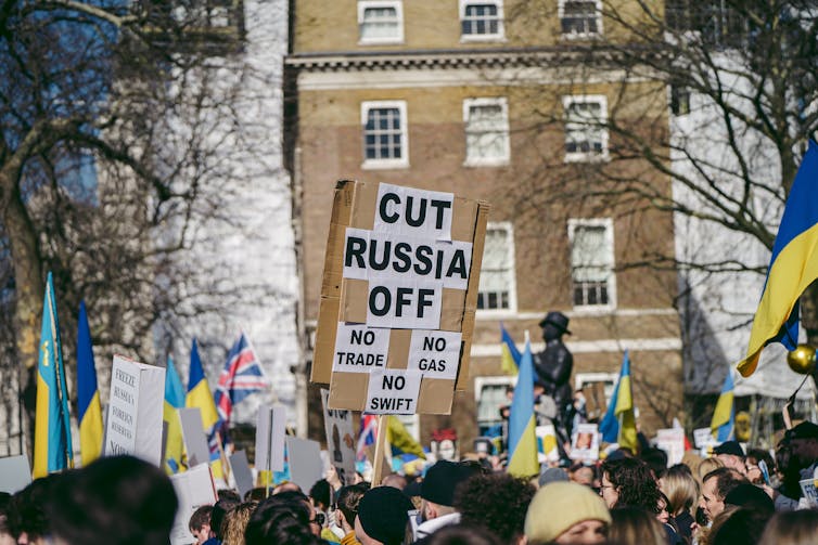 A demonstration with placard calling for Russia to be 'cut off'.