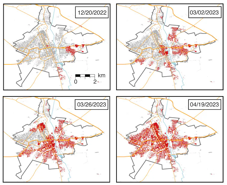four maps of a city with increasing amounts of the buidlings marked in red