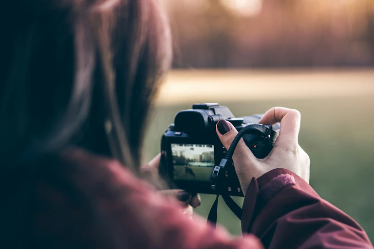A woman uses a camera