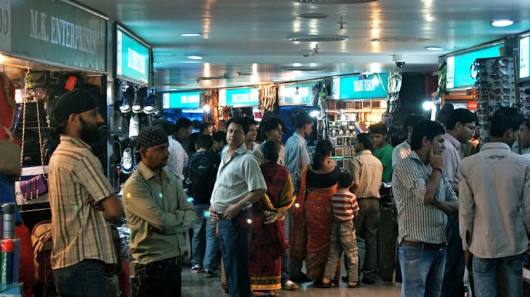 Delhi’s electronic bazaars are one of the city’s last non-elite commercial spaces 4 People in an indoor market.