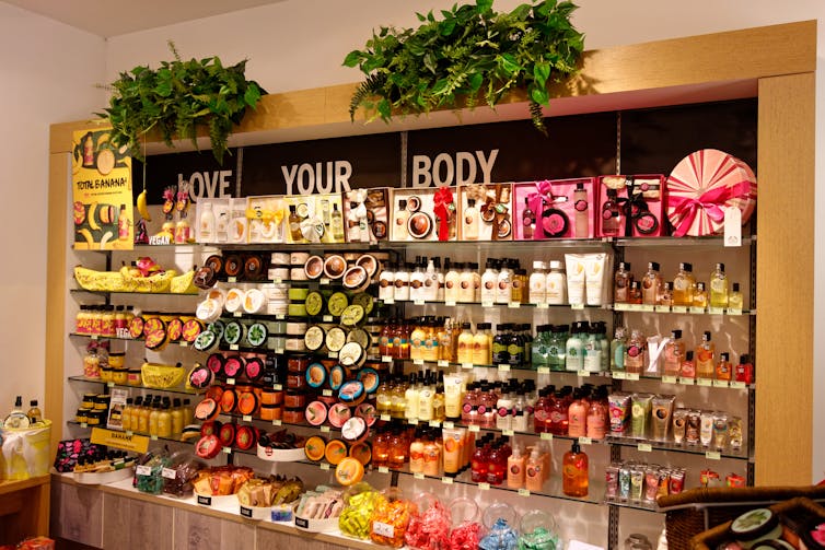 a wall of Body Shop products