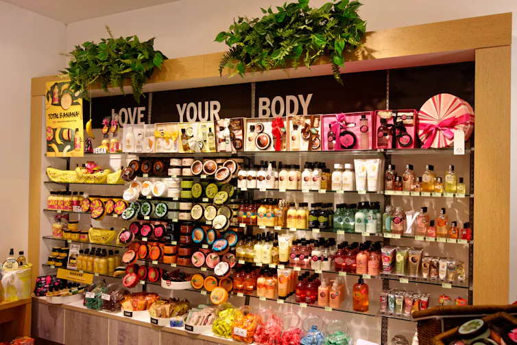 a wall of Body Shop products