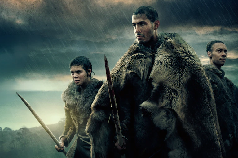 Three Stone Age people with spears