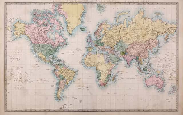 A very old faded map of the world.