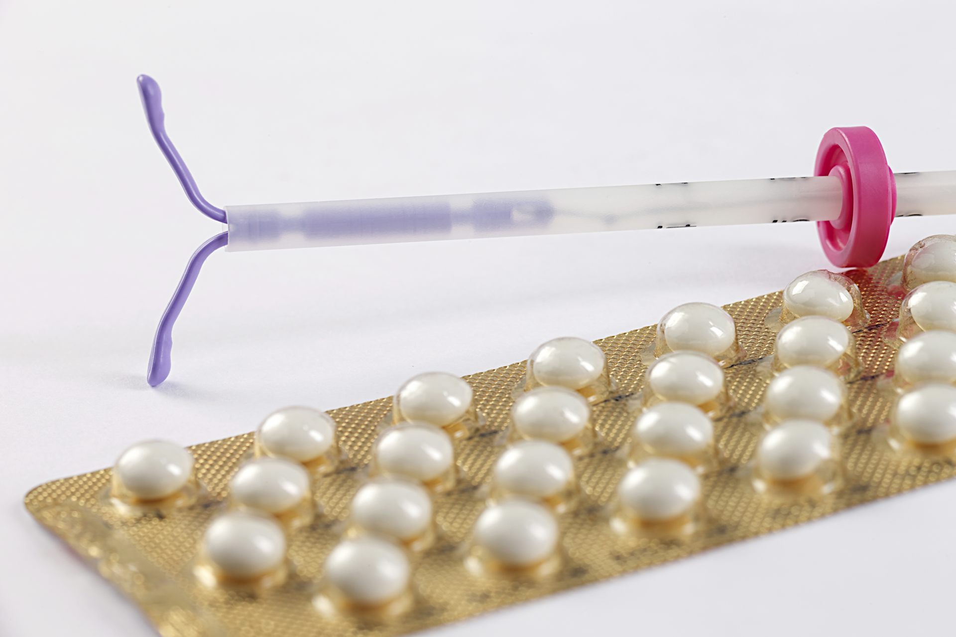 An IUD and birth control pills