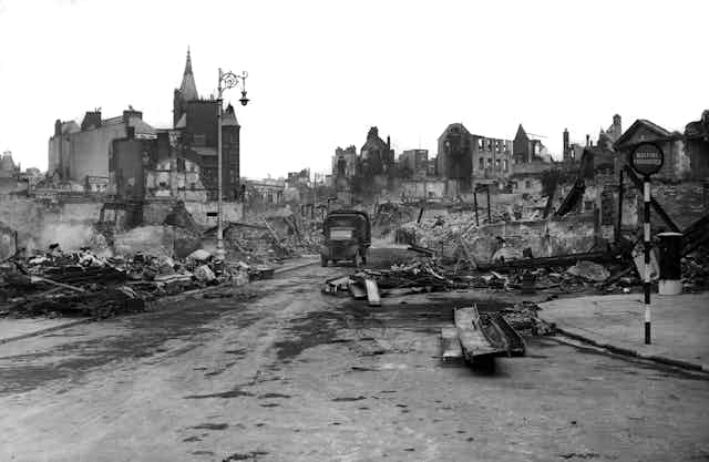 An archival photograph of a bombed city.
