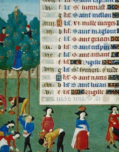 An old manuscript page with lines of font and a brightly colored illustration of men and women standing in a field while others climb trees.