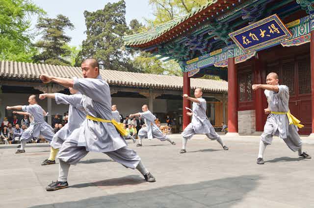 Shaolin monks demonstrating a kung fu form