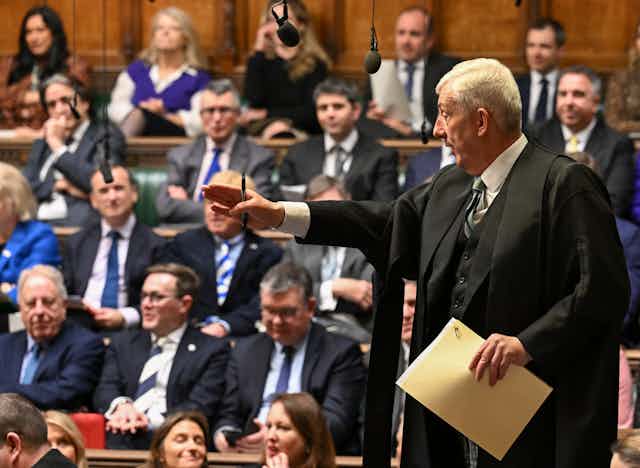 Lindsay Hoyle standing up and giving direction in the House of Commons with  MPs in the background