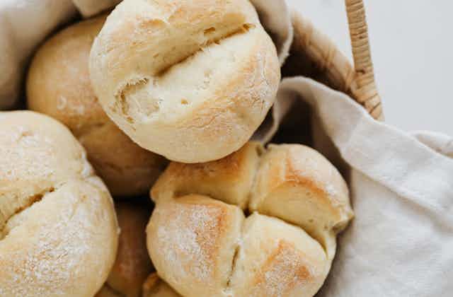 white bread rolls in basket