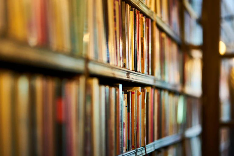 Shelves of books in a library.
