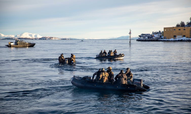 Marines in rubber dinghies on a training exercise in Norway, February 2024.