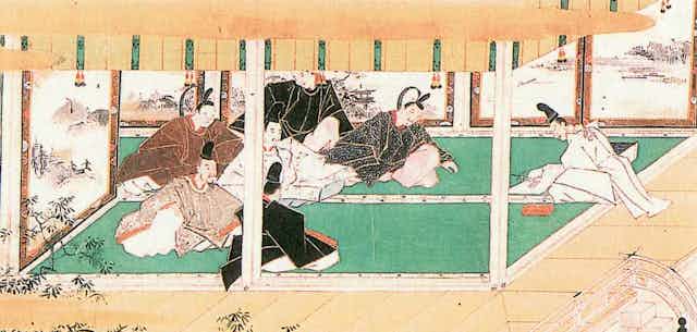 A faded illustration shows six seated men in robes watching another man in robes as he concentrates on something in his hands.