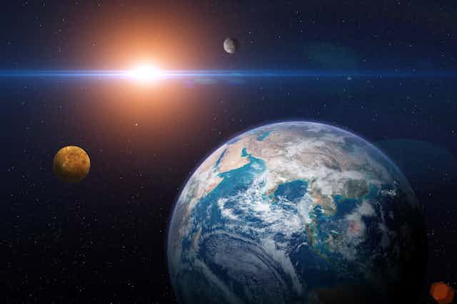 Earth with planets and Sun in space
