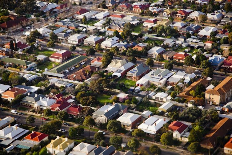 Aerial view of an expanse of Australian suburban rooftops