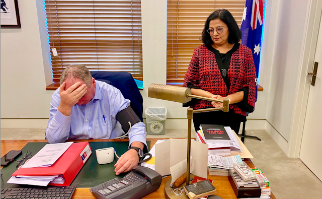 Barnaby Joyce head in hand, while having blood pressure monitored by Associate Professor Sutapa Mukherjee