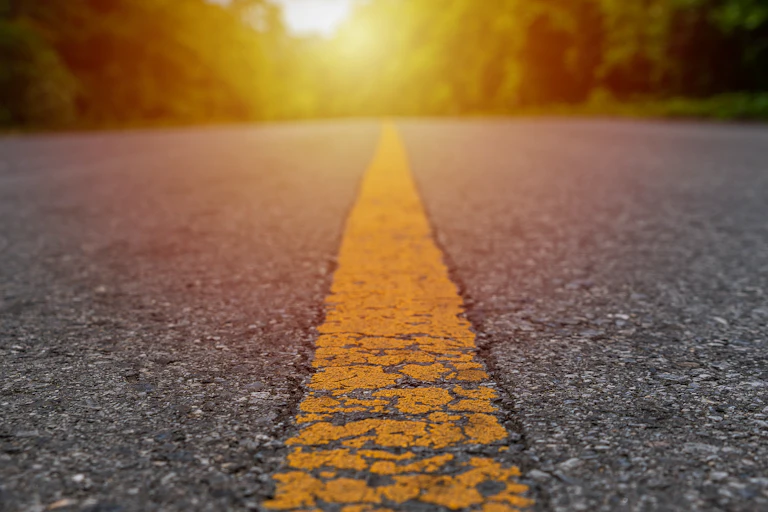 Yellow line on road going straight ahead