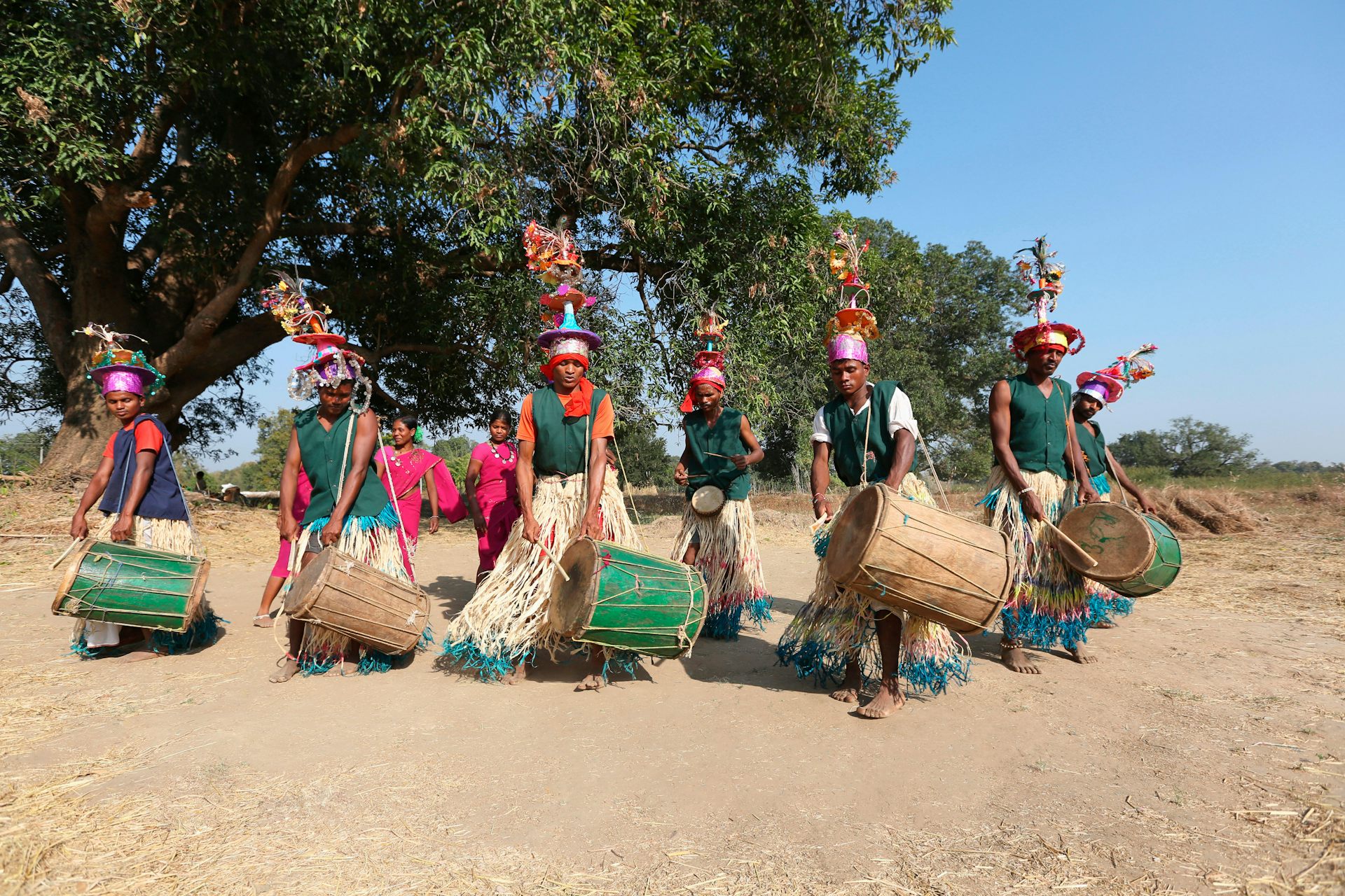 Dancers and drummers in traditional dress.