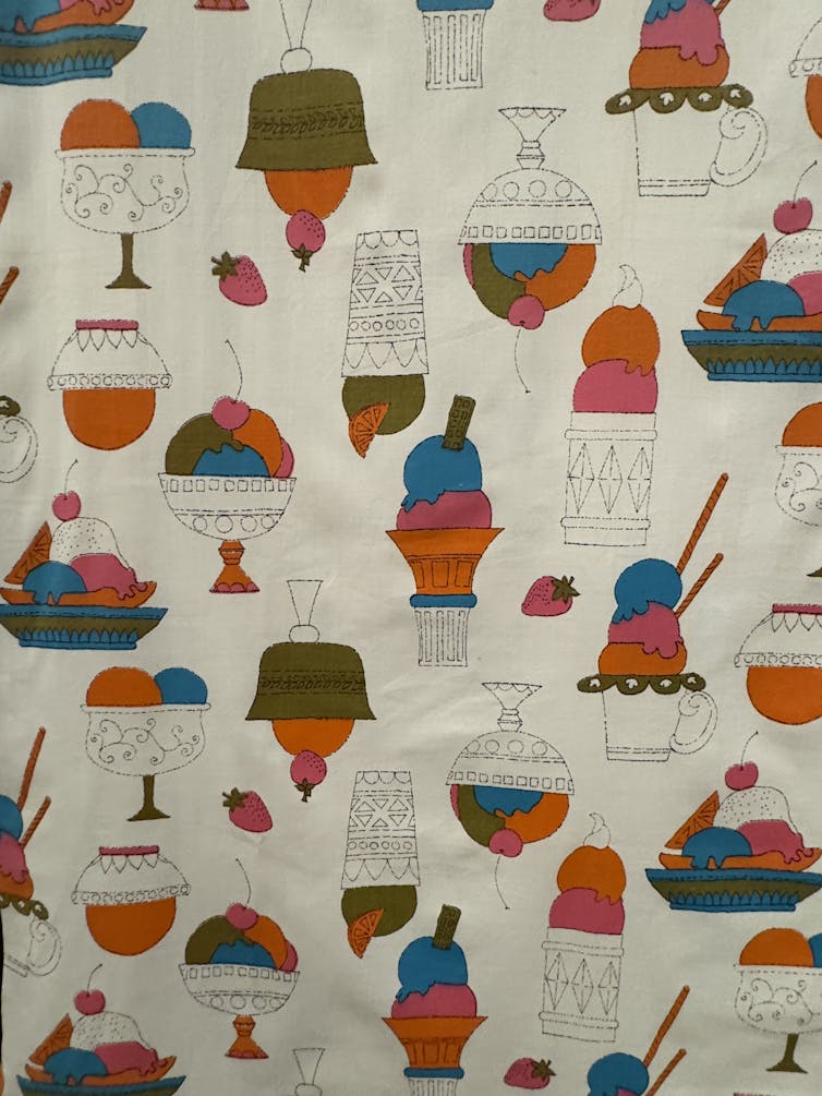 A piece of fabric descorated with ice-cream sundaes.