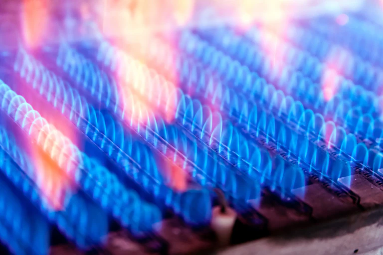 Flames are seen eminating from a gas burner.