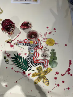A messy pomegranate, transformed into an artwork.
