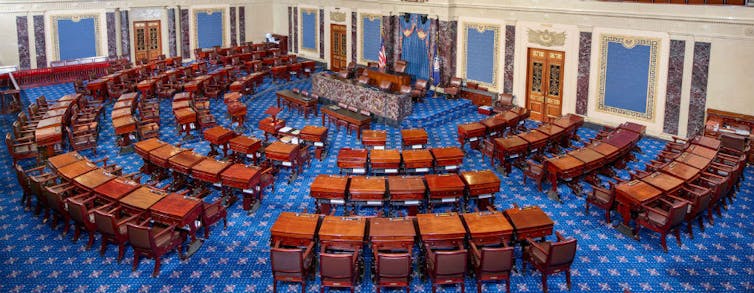 A large room with chairs and desks.