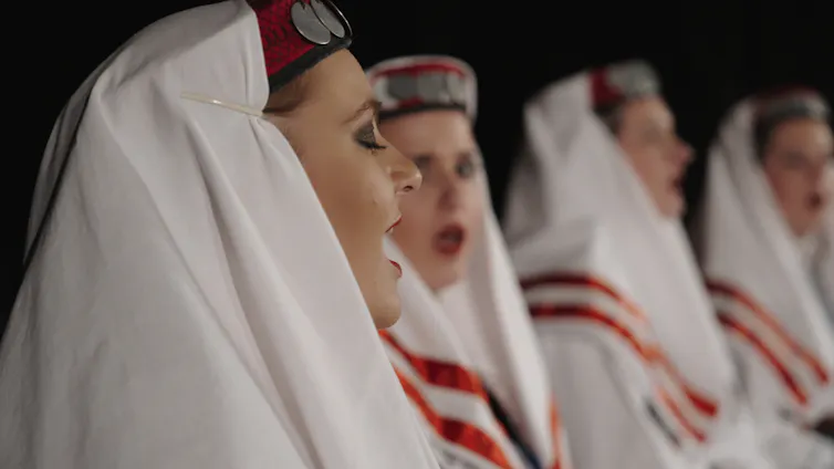 Women singing.