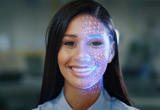A woman's portrait with half of her face overlaid by a blue grid.
