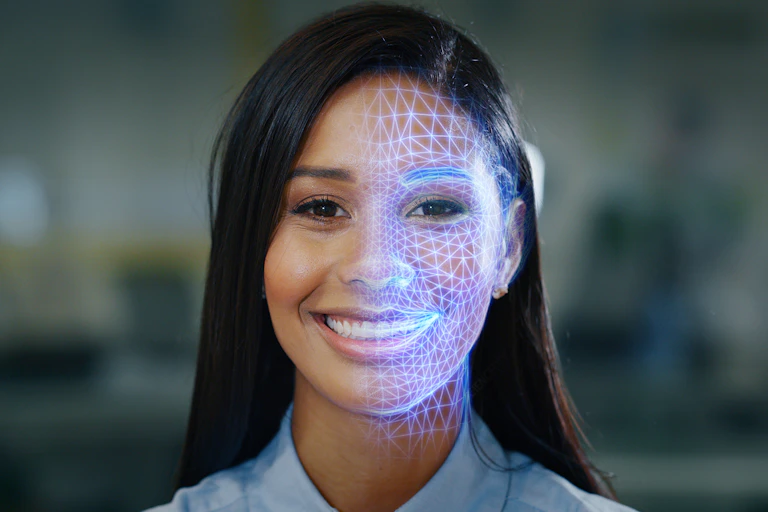 A woman's portrait with half of her face overlaid by a blue grid.