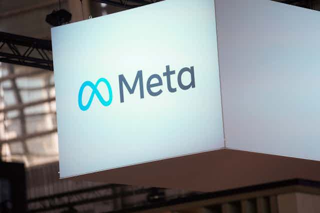 A large white sign reading 'Meta'