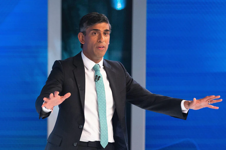 Rishi Sunak with his hands out